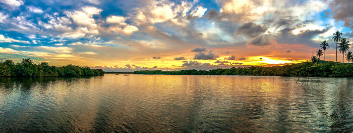 Scenic view of lake against sky during sunset