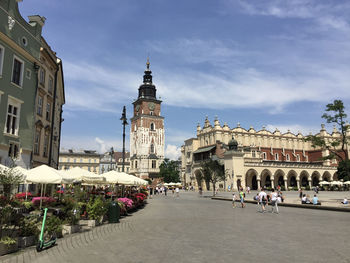 Cloth hall and town hall tower in krakow's main square, the largest medieval town square in europe