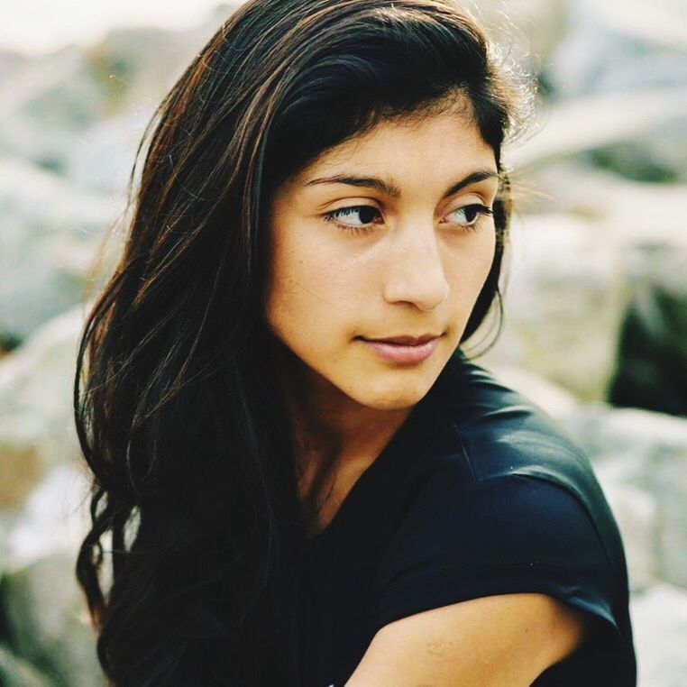 PORTRAIT OF YOUNG WOMAN IN HAIR