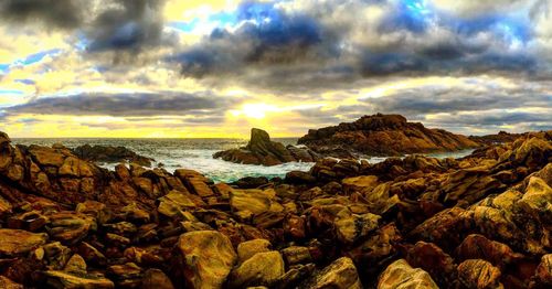 Scenic view of sea against cloudy sky