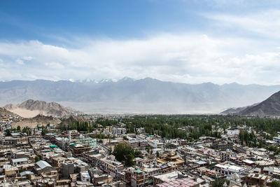 Landscape of leh-ladakh city on large mountain background with and blue sky.