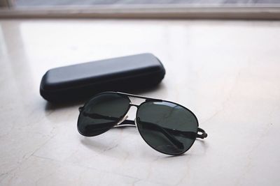 Close-up of sunglasses on table