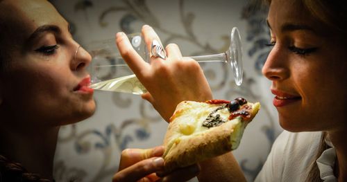 Side view of woman eating food