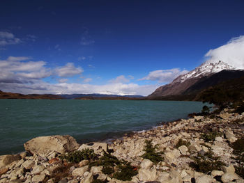 Scenic view of sea against blue sky