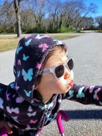 Close-up of girl wearing sunglasses