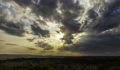 Scenic view of dramatic sky over land