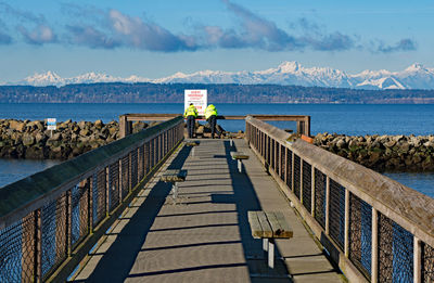 Pier over sea against sky