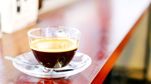 Close-up of coffee on wooden table