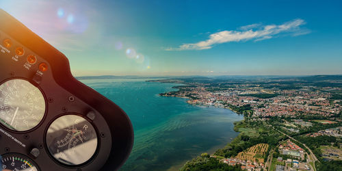 Helicopter cockpit with aerial view on lake constance in germany