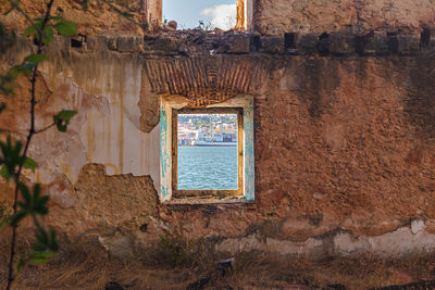 Window on old wall of building