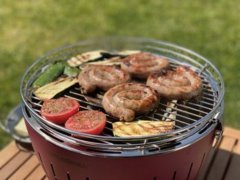High angle view of meat in barbecue grill