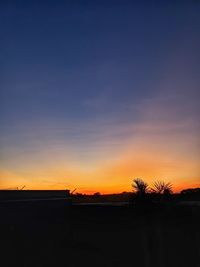 Scenic view of silhouette landscape against sky during sunset