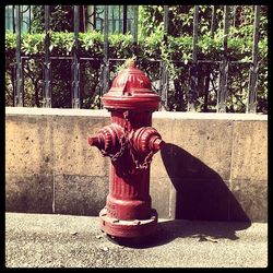 Close-up of fire hydrant on sidewalk