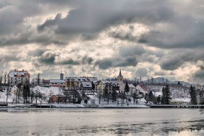 Panoramic view of buildings and sea against sky