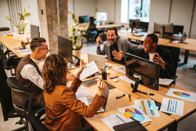 High angle view of business colleagues working in office