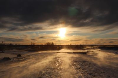 Scenic view of landscape against sky during sunset