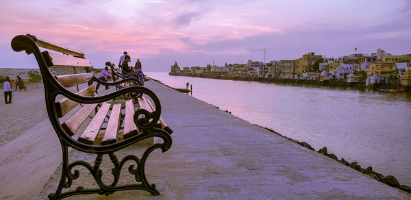 Empty bench on riverfront 