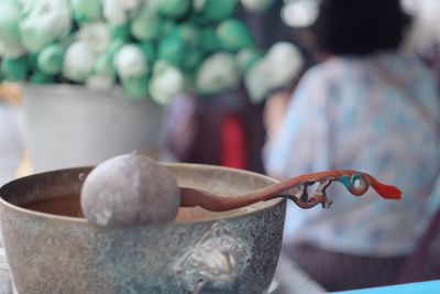 Close-up of spoon in bowl on table