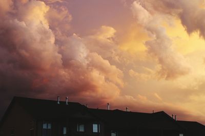 High section of building against cloudy sky