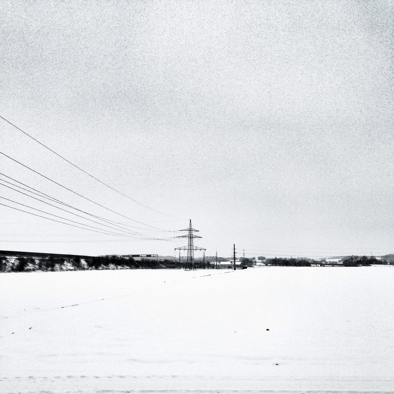 fuel and power generation, clear sky, copy space, tranquility, power line, electricity pylon, tranquil scene, nature, electricity, sky, connection, scenics, outdoors, water, landscape, power supply, day, beauty in nature, no people, technology