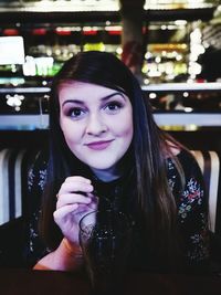 Close-up portrait of a smiling young woman