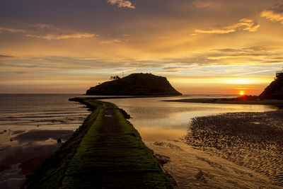 Scenic view of sea against sky during sunset