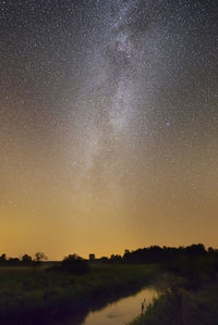 Scenic view of star field against sky at night