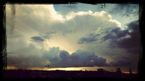 Scenic view of cloudy sky at sunset