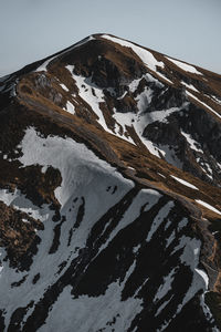 Snow covered mountain against sky