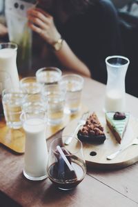 High angle view of coffee glass with milk and pie on table at restaurant