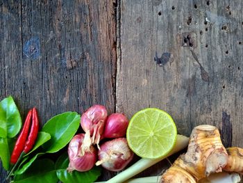 High angle view of fruits and leaves on table