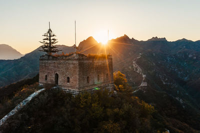 Panoramic view of historic building against sky during sunset