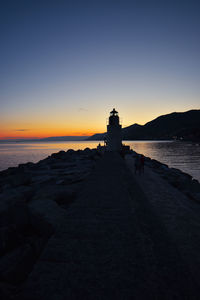 Scenic view of sea against clear sky during sunset