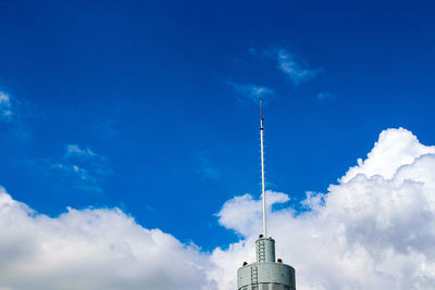 Low angle view of buildings against blue sky