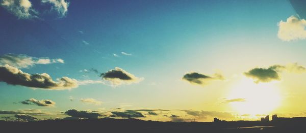 Low angle view of silhouette trees against sky