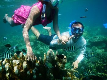 People swimming in sea