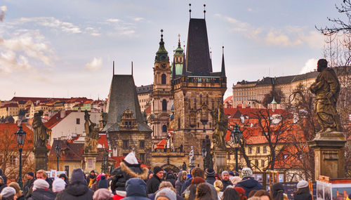 People at st vitus cathedral against sky