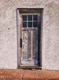 Old door on abandoned building 