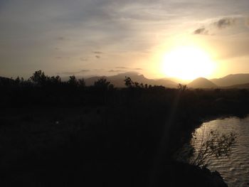 Scenic view of landscape at sunset