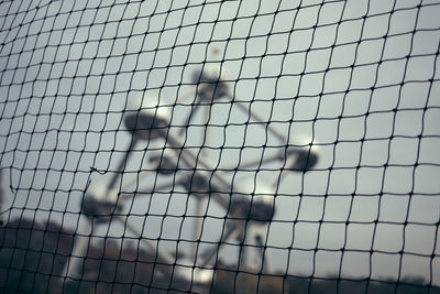 Full frame shot of metal fence against sky