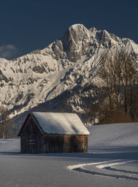 Scenic view of snowcapped mountains against clear sky