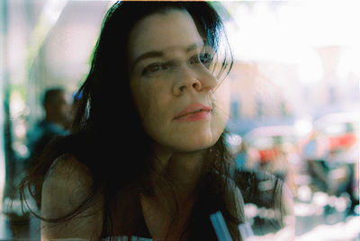 Close-up portrait of smiling young woman