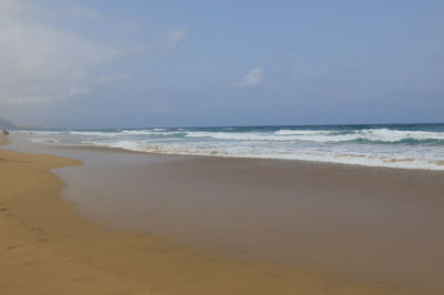 Scenic view of beach against sky