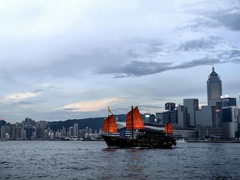 Buildings in city against sky