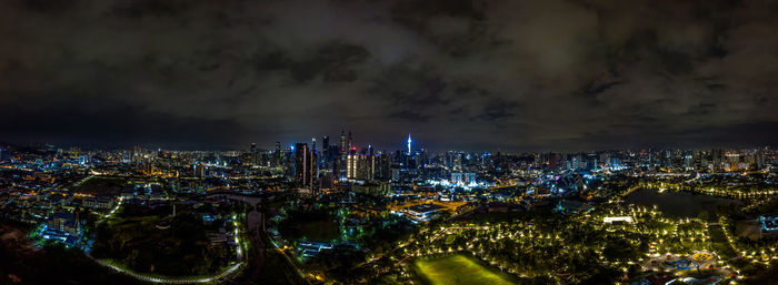 High angle view of illuminated city buildings at night