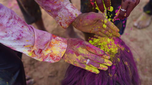 Festival of colors, traditional indian holiday holi. young people have fun during holi by throwing 