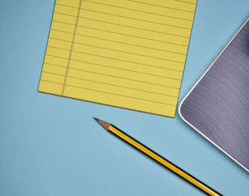 Close-up of pencil and paper on table