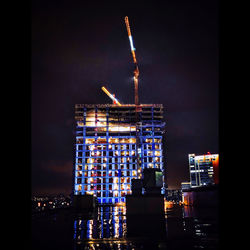 Illuminated buildings in city at night