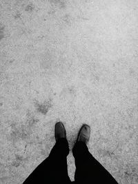 Low section of man standing on floor