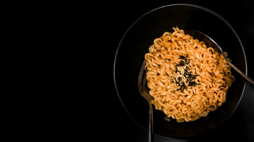 High angle view of breakfast in bowl against black background